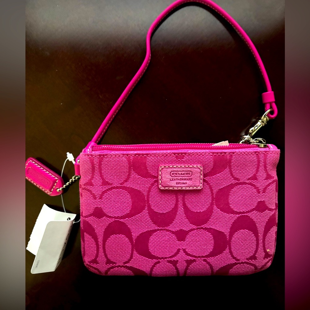 NWT Coach “C” pink small mini skinny wristlet